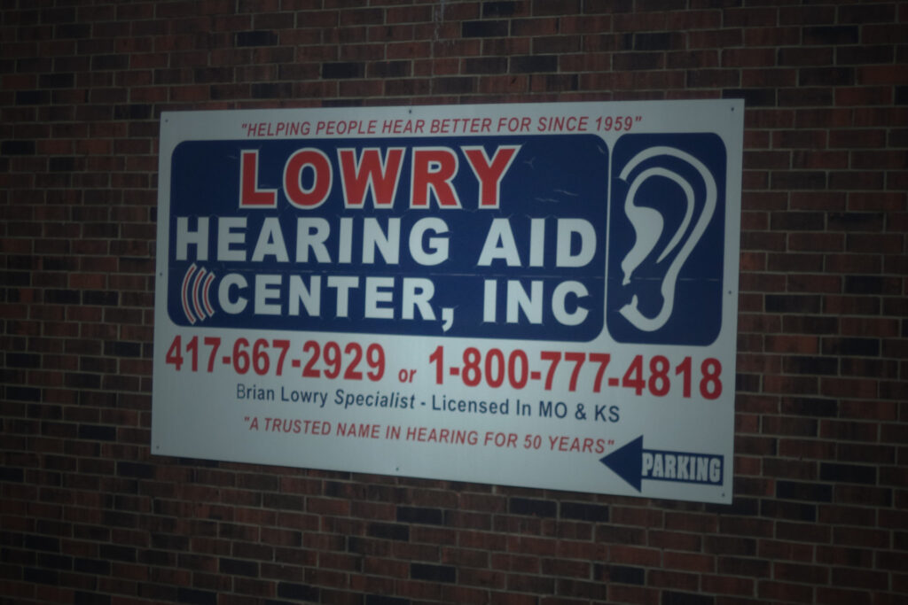 Lowry Hearing Aid Center sign on outside wall of Nevada location